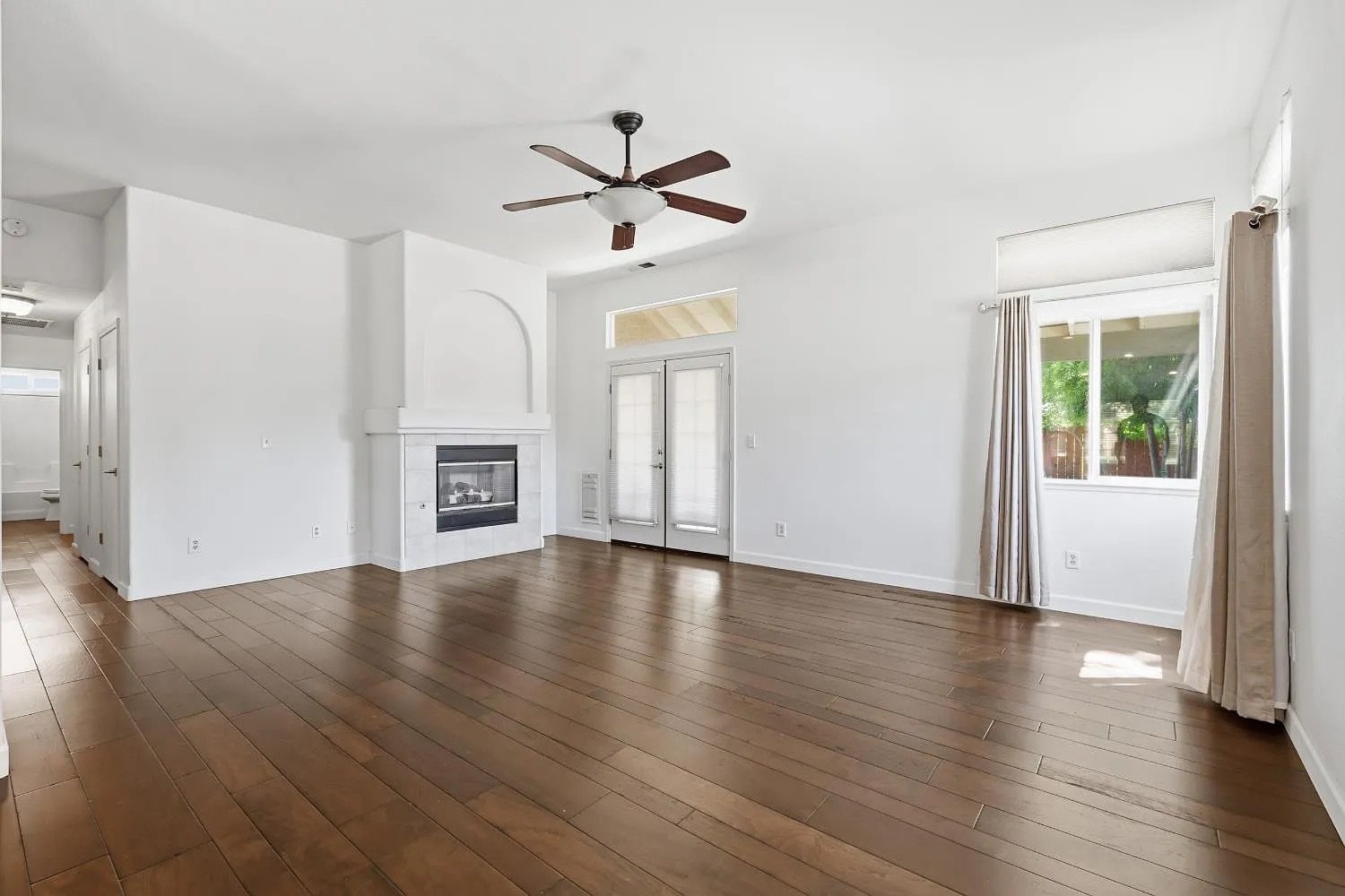 Family Room with Fireplace and French Doors to Backyard