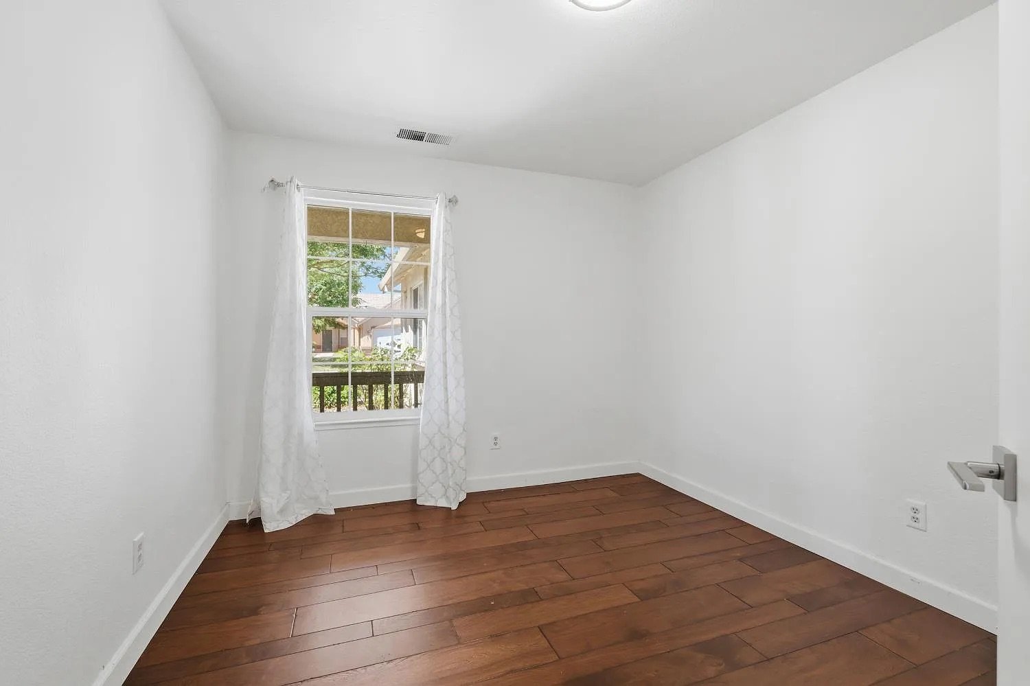 Secondary Bedroom with Dark Hardwood Floors