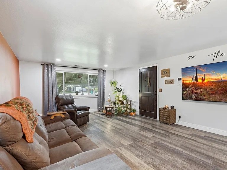 Living Room — LVP flooring, leather furniture